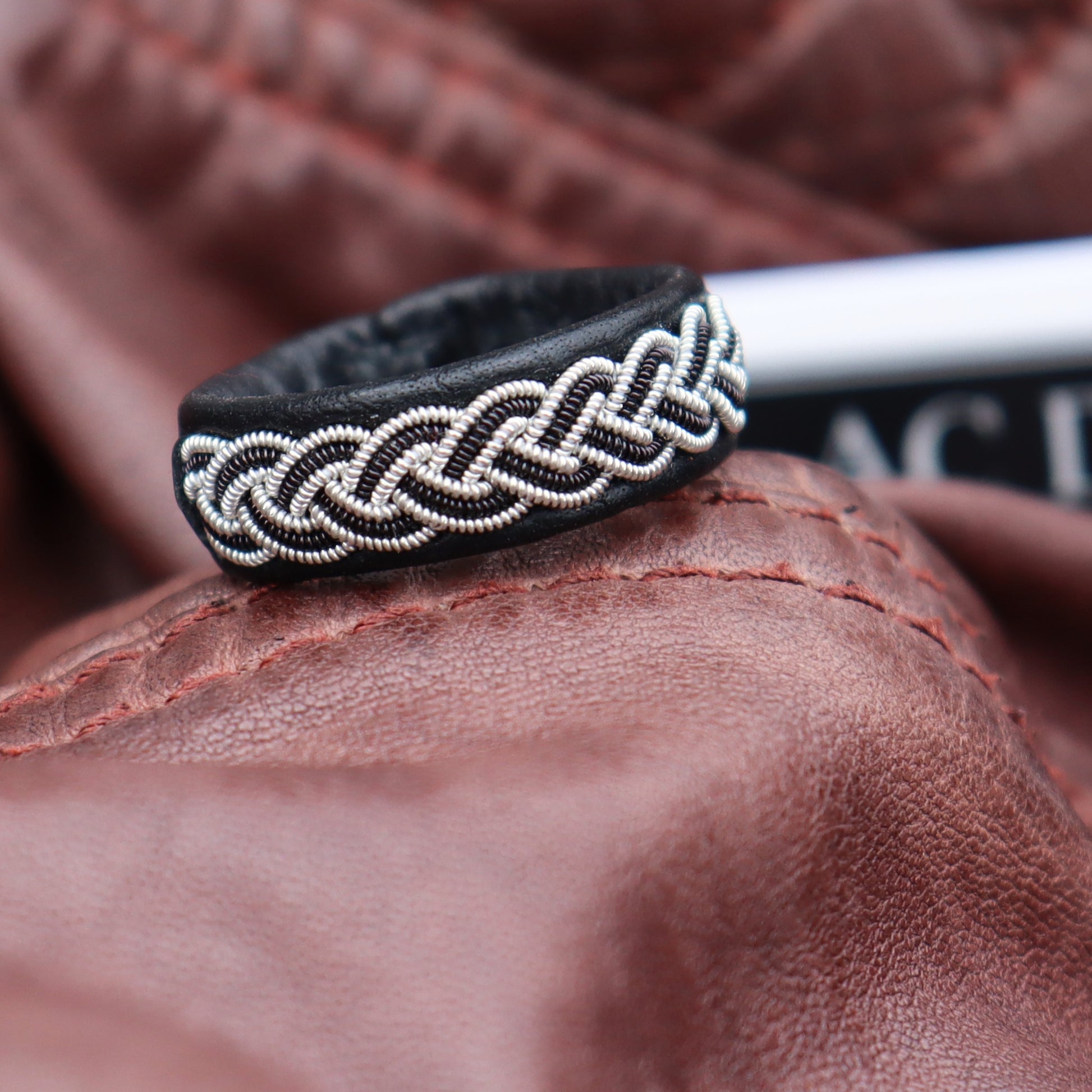 Sami ring in black reindeer leather with pewter copper braid 