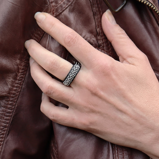 Sami ring in black leather with pewter braid, worn on finger