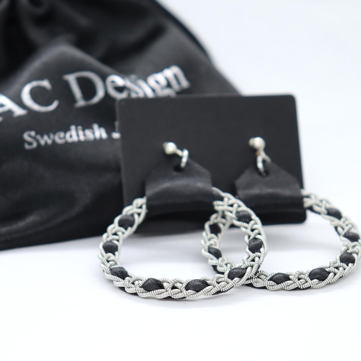 Handmade Sami earrings in Black reindeer leather and pewter braids.