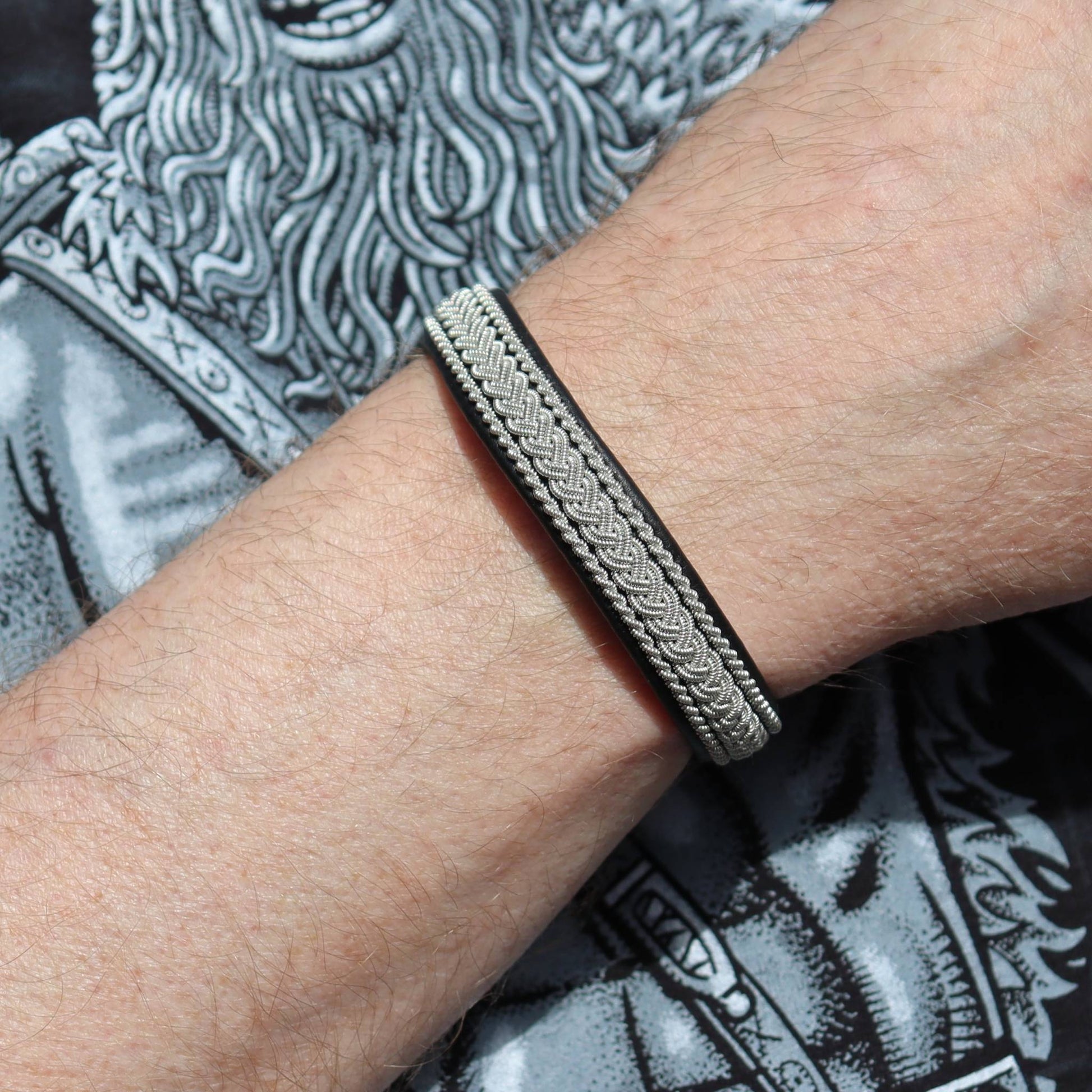 black Sami leather bracelet with  pewter braids shown on wrist to highlight fit