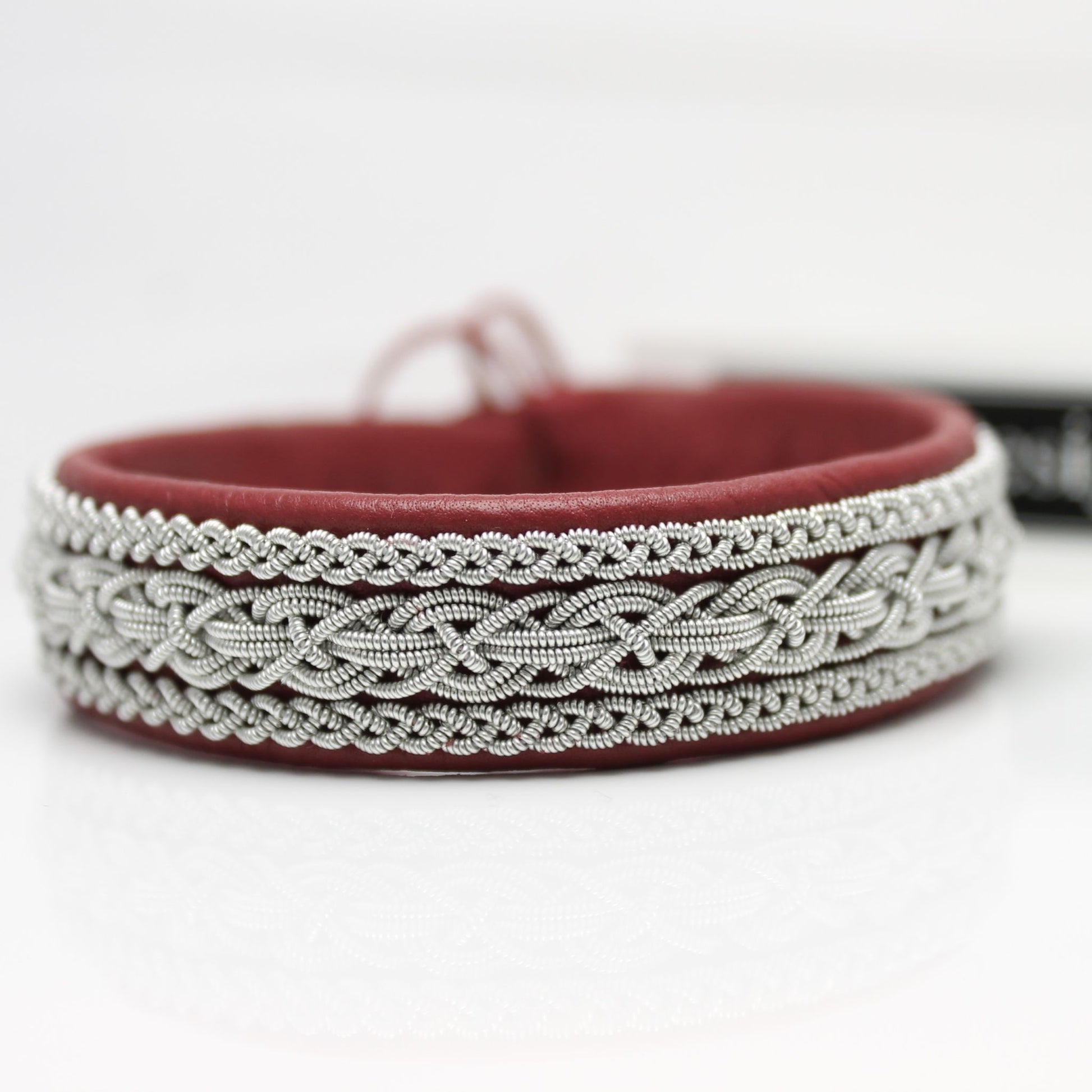 handmade sami bracelet in pewter thread and red reindeer leather