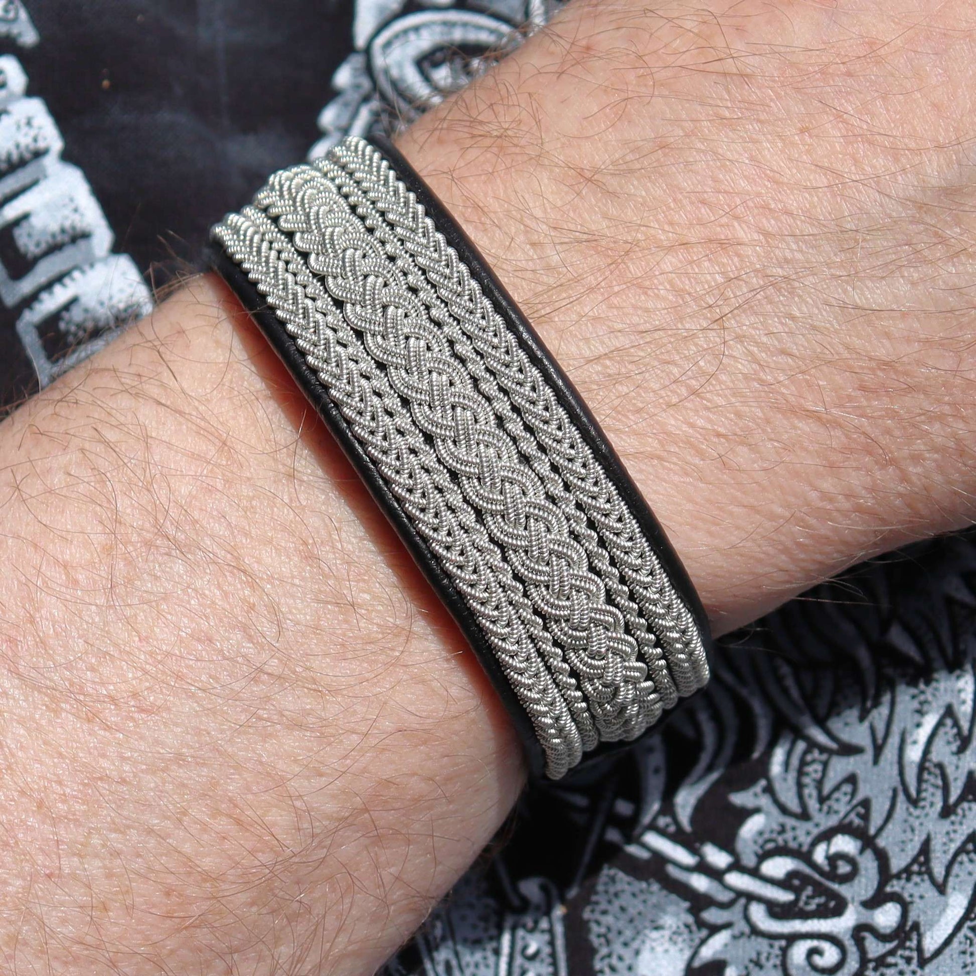 Sami leather bracelet with pewter braid shown on wrist